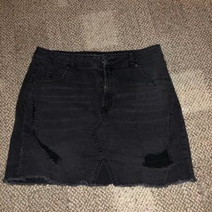 Distressed black jean skirt